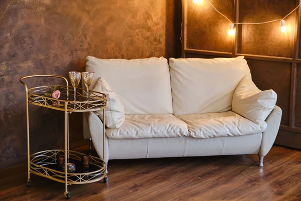 A beautifully reupholstered white leather sofa A beautifully reupholstered white leather sofa