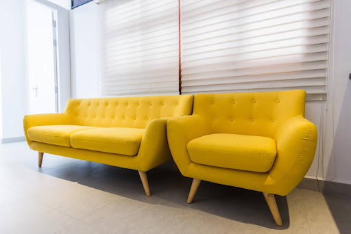 Appearance of two yellow sofa after upholstery work