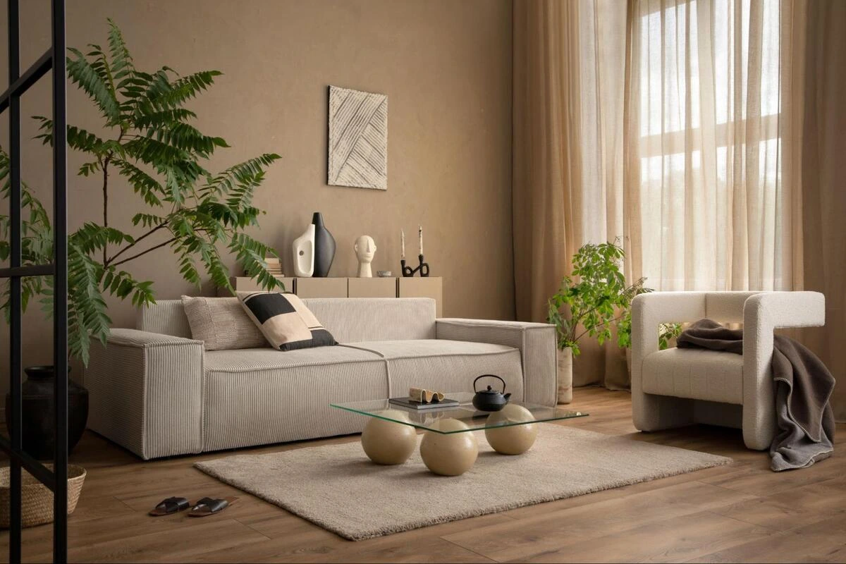 Modern living room with a beige fabric sofa set after reupholstery