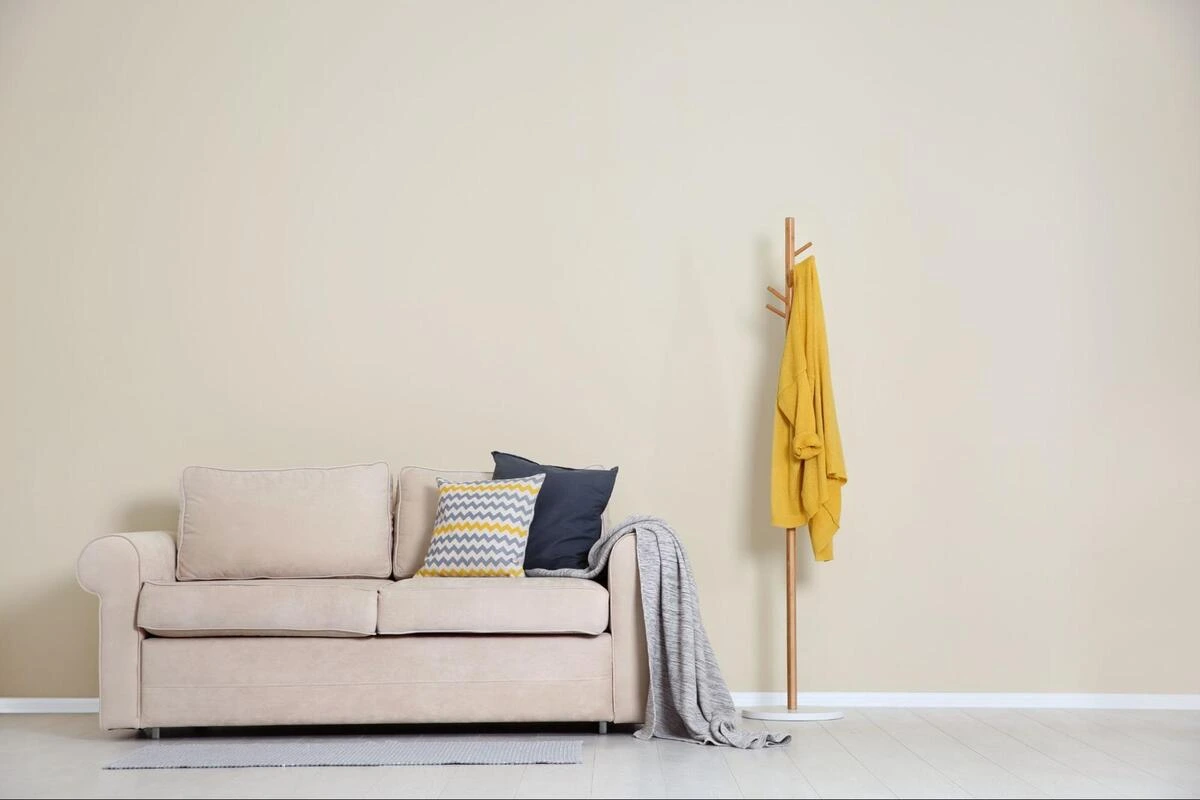 Minimalist Living Room Sofa - Performance Fabric Upholstery Example Minimalist living room with cream sofa and cushions showing modern sofa reupholstery suitable for kid-friendly and pet-friendly interiors