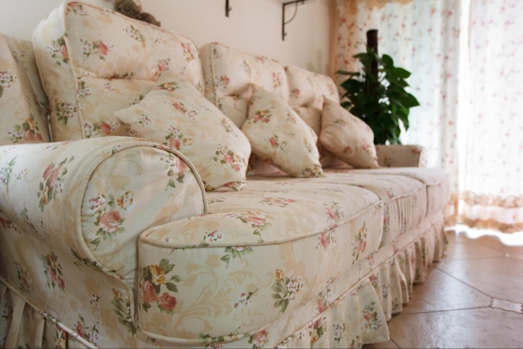 Sofa upholstered in soft floral cotton fabric with matching cushions